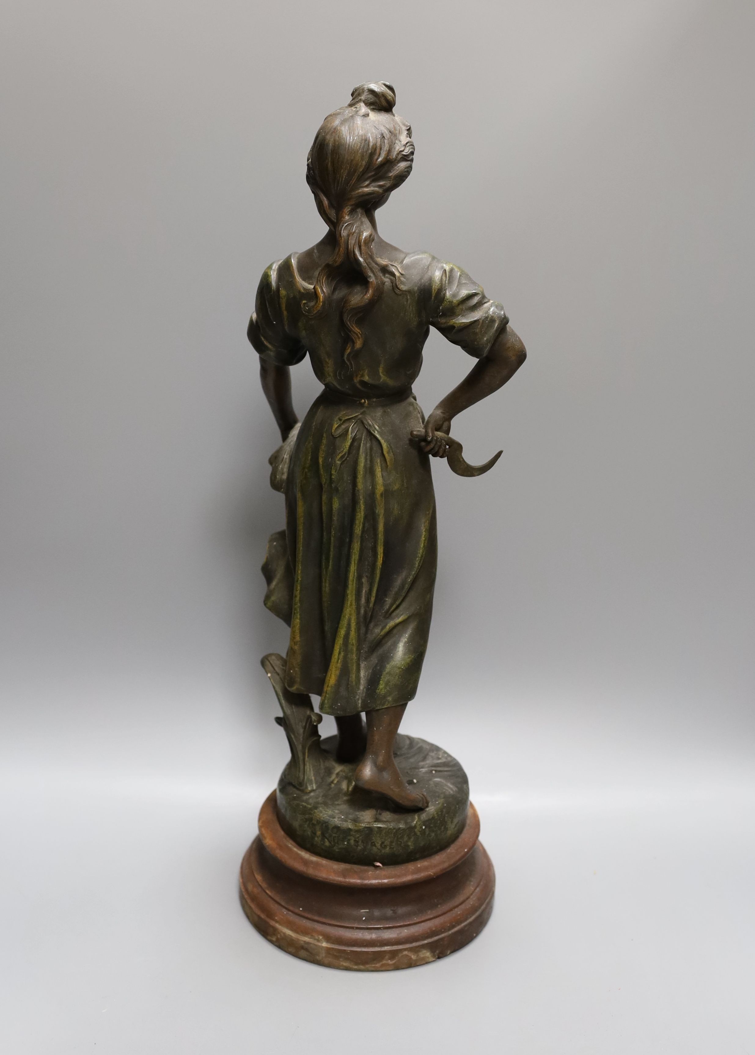 After Sylvain Kinsburger, an early 20th century French painted spelter statuette ‘Glaneuse’ 51cm